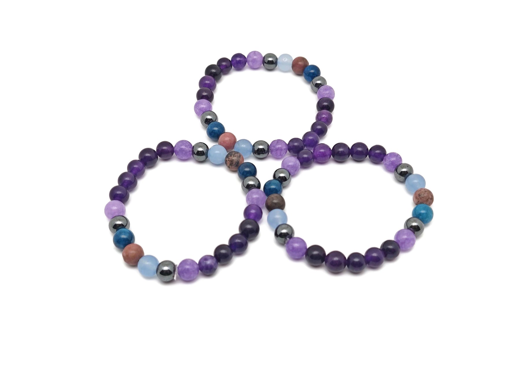 Handmade Heal gemstone bracelet with colorful stones and adjustable cord, designed for positive intentions and healing.