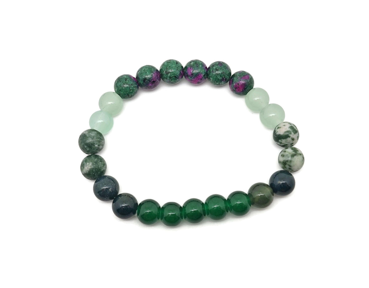Handmade New Beginnings gemstone bracelet with colorful beads and a silver charm, designed for positive intention and style.