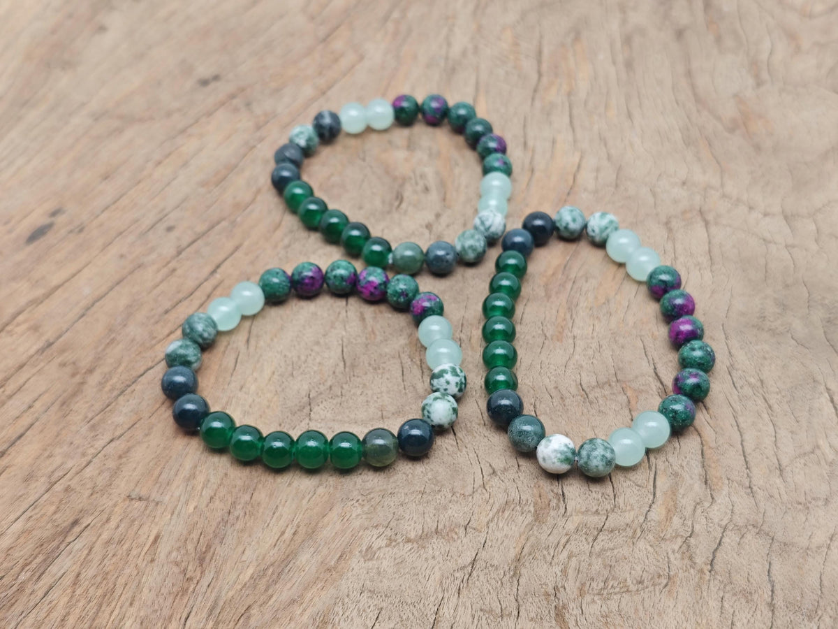 Handmade New Beginnings gemstone bracelet with colorful beads and adjustable cord, designed for positive intentions and style.