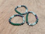 Handmade New Beginnings gemstone bracelet with colorful beads and adjustable cord, designed for positive intentions and style.