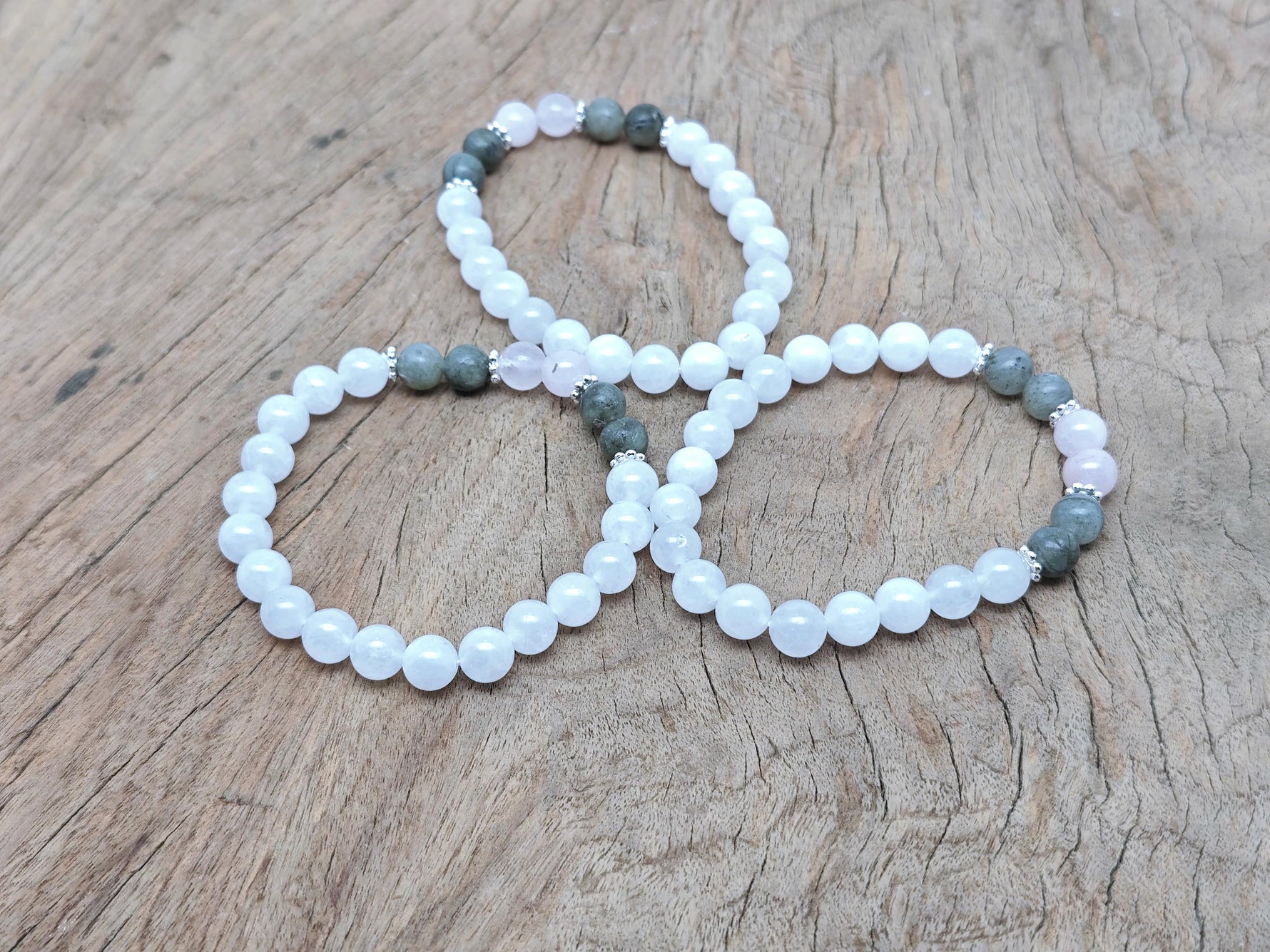 Handmade gemstone balance bracelet featuring colorful beads and a central charm, designed for intention and harmony.