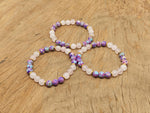 Handmade Dear Mom gemstone bracelet with colorful beads and adjustable cord, designed as an intention jewelry piece.
