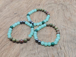 Handmade Promete gemstone bracelet with colorful beads and adjustable cord, designed for intention and spiritual wear.