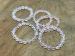 Rose quartz beaded crystal bracelet for men and women, stretchy design with healing properties, from GemstoneGO.
