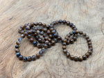 Bronzite beaded crystal bracelet with stretchy design, suitable for men and women, featuring healing crystal stones from GemstoneGO.