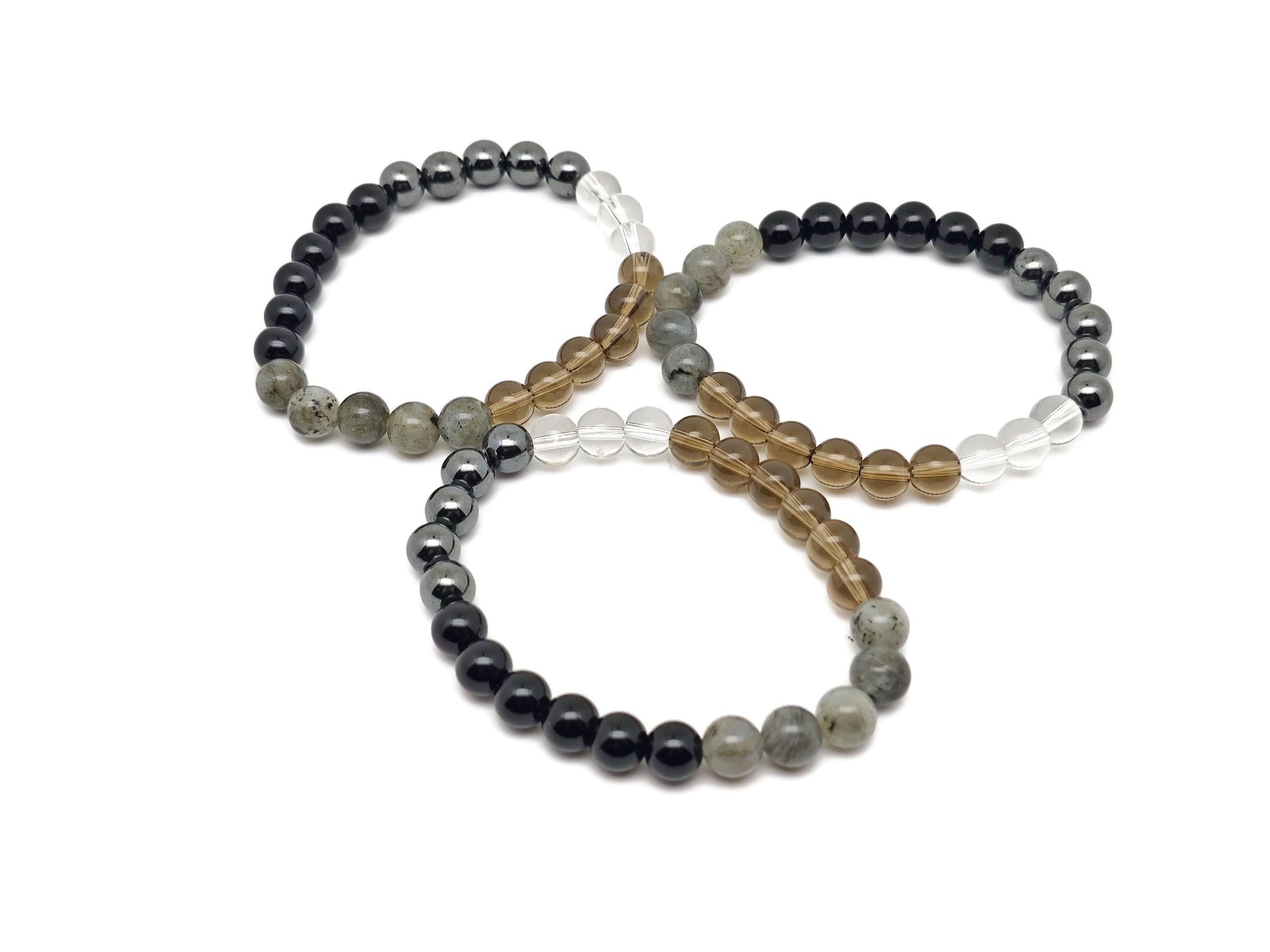 Handmade anti-anxiety gemstone bracelet with colorful beads and a silver charm, designed for calming and positive intentions.