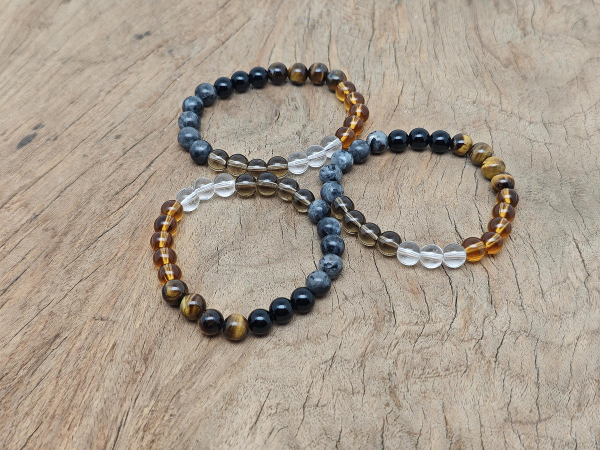 Handmade gemstone health bracelet with colorful beads and adjustable cord, designed for positive intentions and wellness.