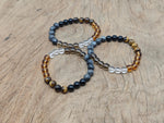Handmade gemstone health bracelet with colorful beads and adjustable cord, designed for positive intentions and wellness.
