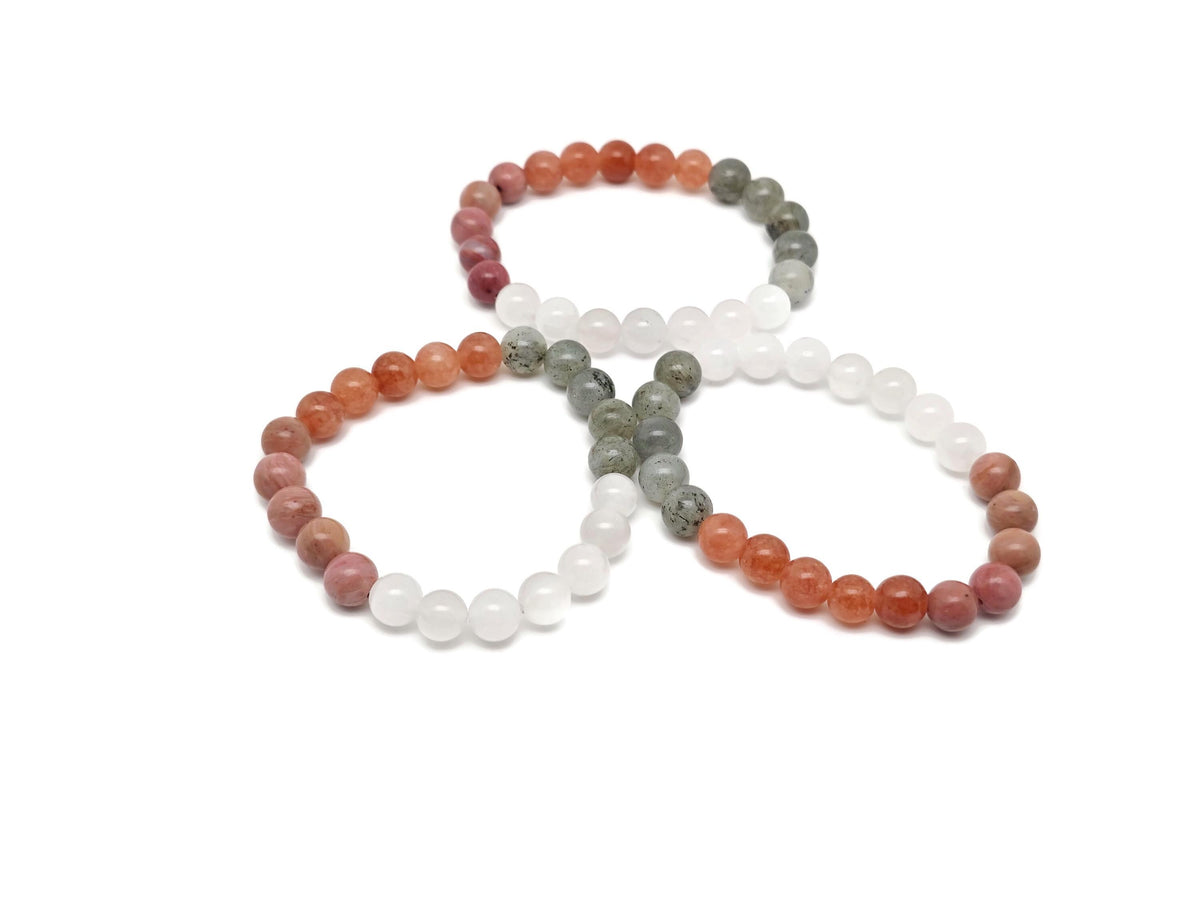 Handmade self-love gemstone bracelet with colorful beads and a silver clasp, designed for positive intentions and self-care.