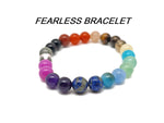 Handmade gemstone bracelet with colorful beads and silver accents, designed as an intention jewelry piece by GemstoneGO.