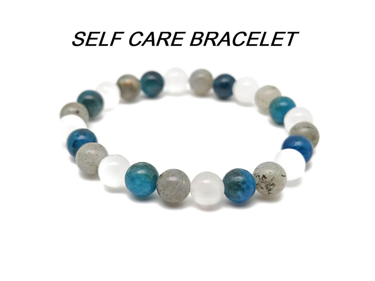 Handmade gemstone self-care bracelet with colorful beads and adjustable cord, designed for positive intentions and wellness.