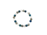 Handmade self-care gemstone bracelet with colorful beads and natural stones, designed for intention and wellness.