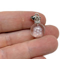 Mini snowflake clear quartz ball crystal pendant from GemstoneGO featuring a transparent gemstone with intricate snowflake patterns.