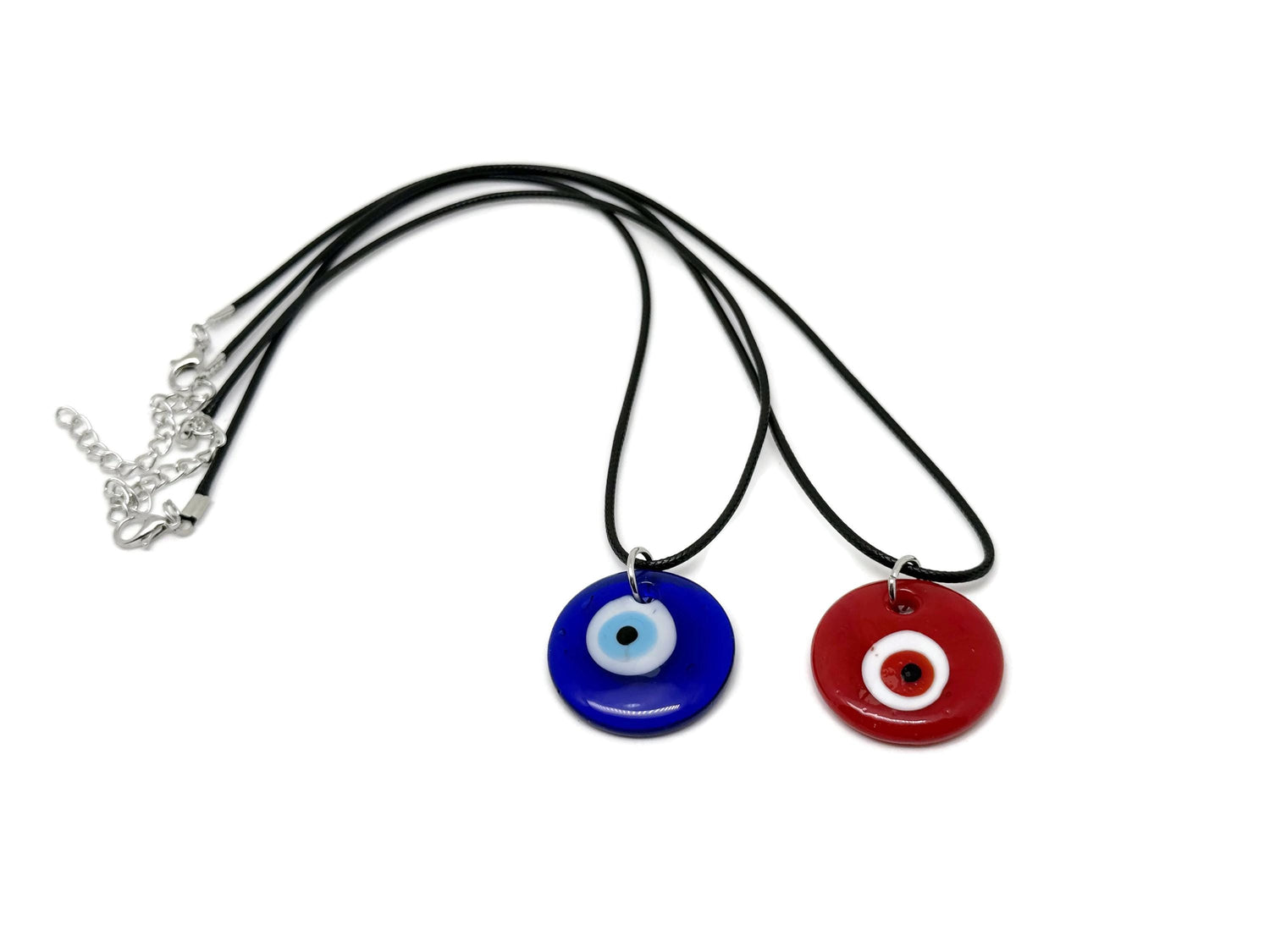 Blue and red glass evil eye necklace featuring gemstone accents, designed to ward off negative energy and serve as stylish jewelry.