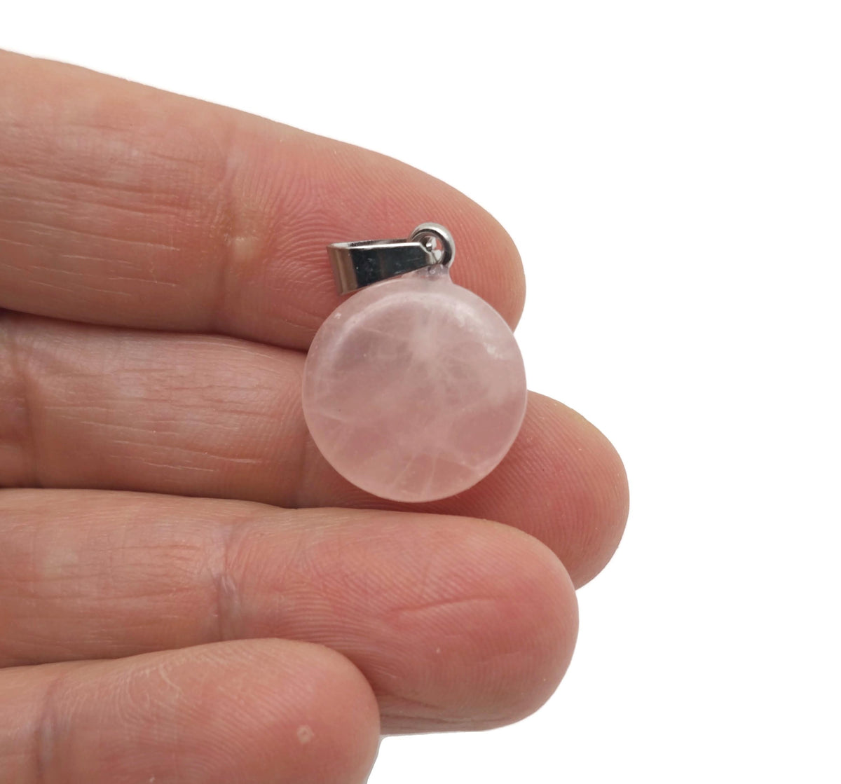 Rose quartz flat round gemstone pendant with crystal coin design, featuring a smooth, polished pink stone on a delicate chain.