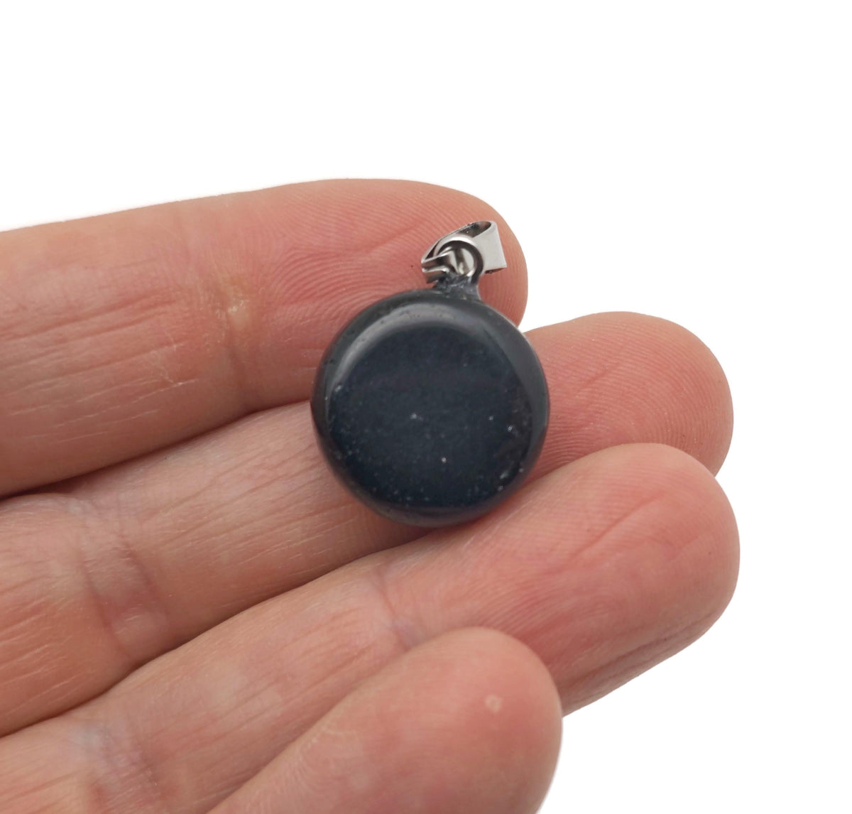 Obsidian flat round gemstone pendant with a polished crystal coin design, featuring a smooth, glossy black surface.