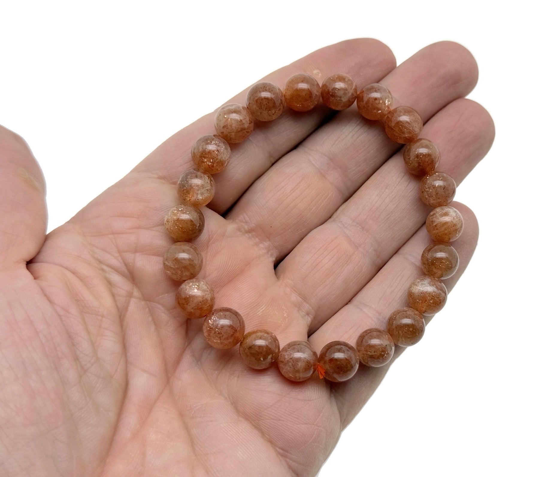 Beaded crystal bracelet for men and women with stretchy design, featuring shimmering gemstones and healing crystal stones.