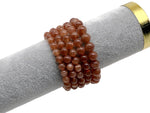 Beaded crystal bracelet for men and women featuring stretch design and healing gemstones, with colorful beads and a silver clasp.