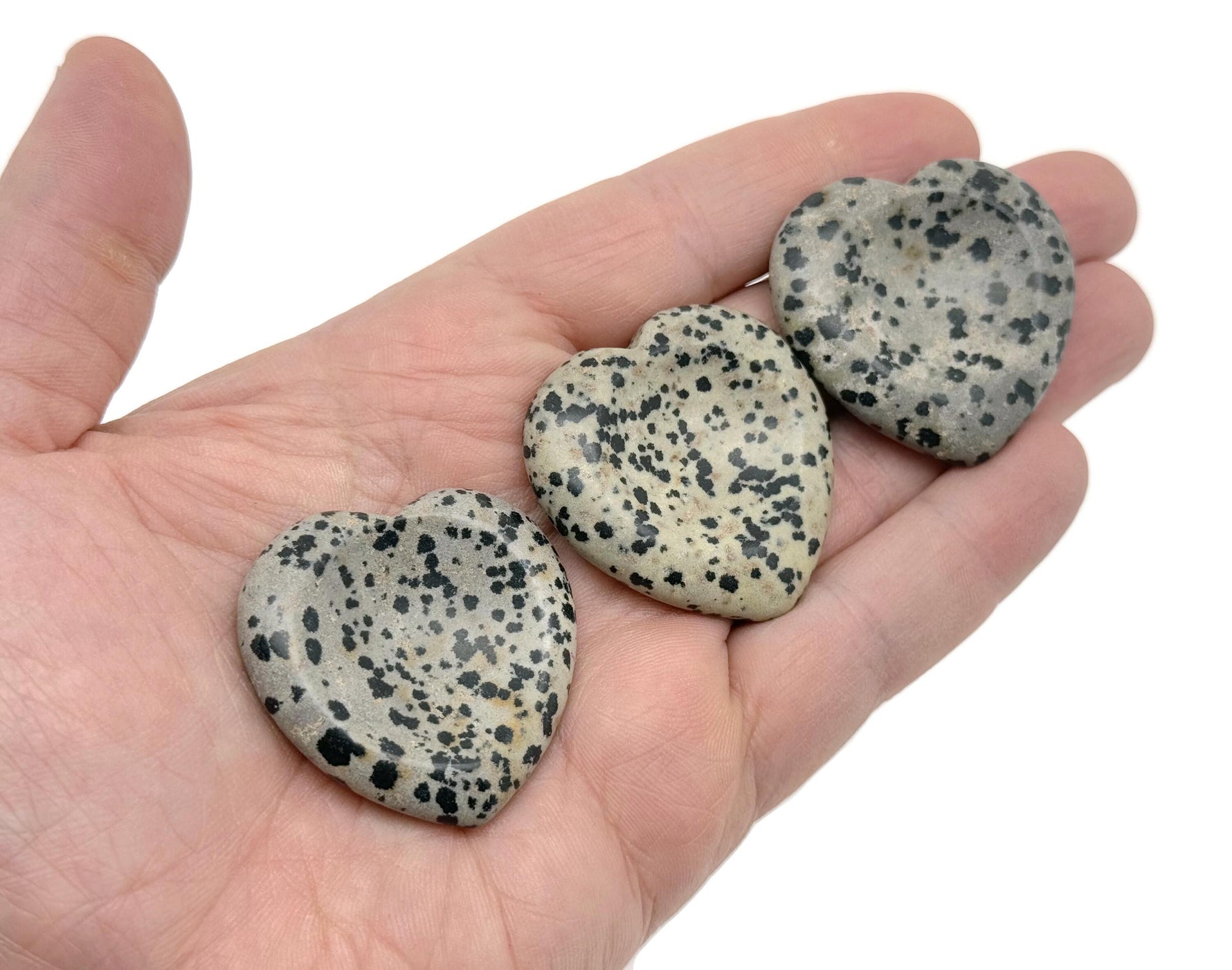 Natural crystal worry stone from GemstoneGO, soothing heart chakra crystal for stress relief and relaxation, travel-friendly healing stone.