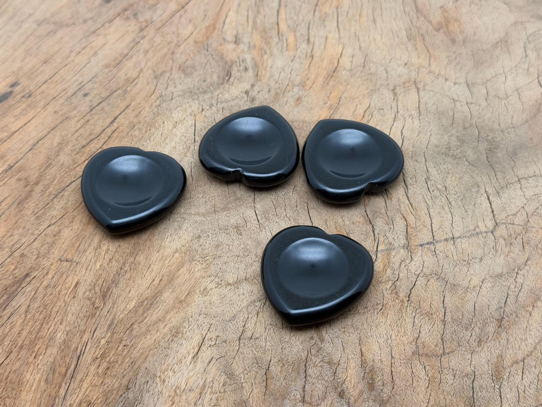 Obsidian heart-shaped worry stone from GemstoneGO with smooth, polished surface for soothing crystal healing.
