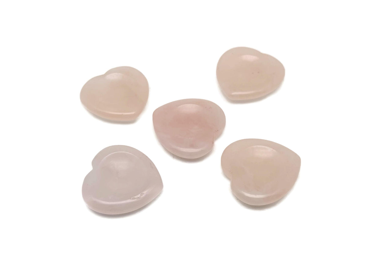 Rose Quartz heart worry stone from GemstoneGO, a soothing crystal for stress relief and emotional healing, shown in close-up.
