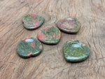 Unakite heart worry stone from GemstoneGO, soothing crystal with pink and green hues, oval-shaped gemstone for stress relief.