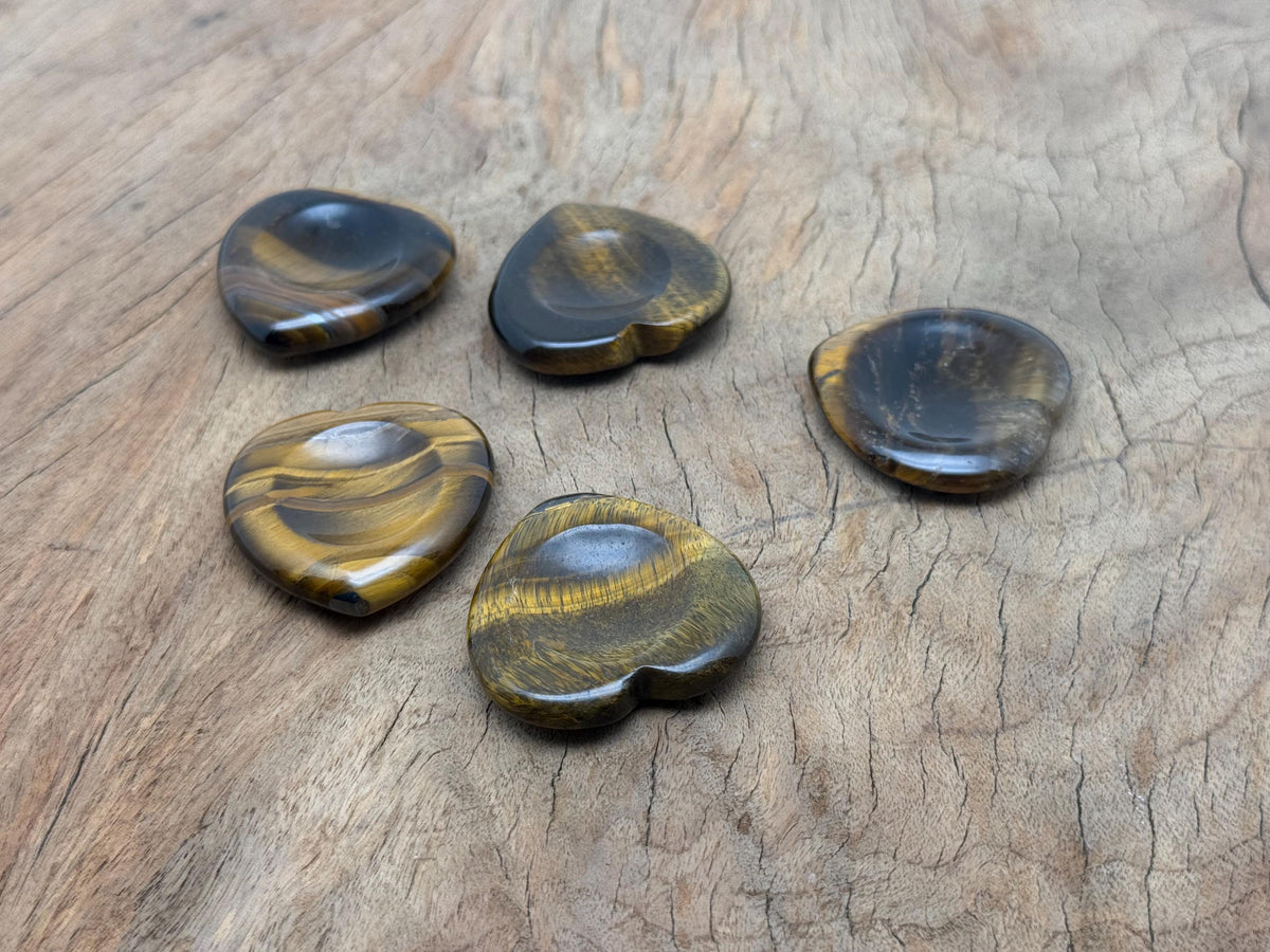 Tiger Eye heart worry stone from GemstoneGO, a soothing crystal with polished surface for calming stress relief.