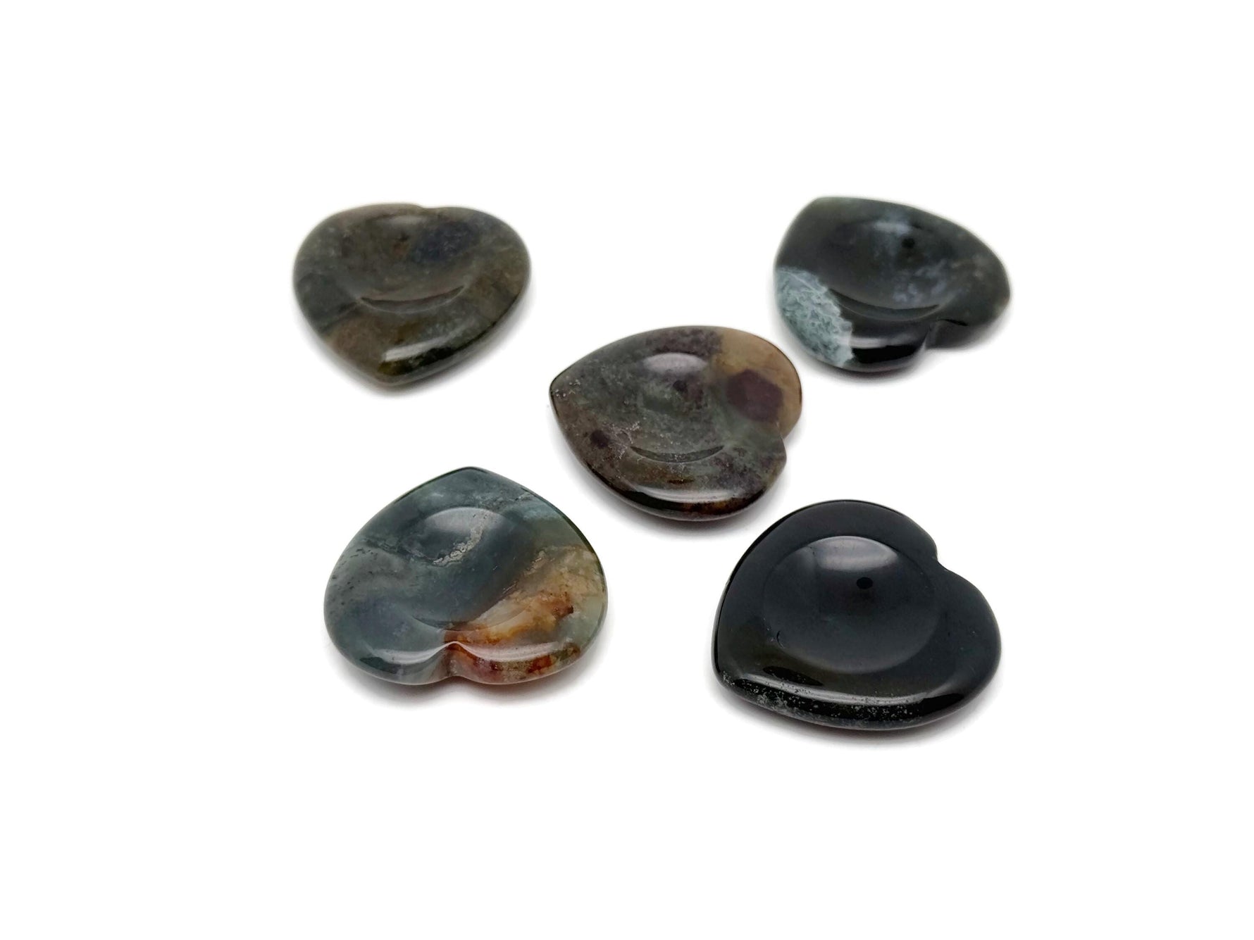 Moss agate heart worry stone from GemstoneGO, soothing crystal with natural green and brown patterns, oval-shaped healing gemstone.