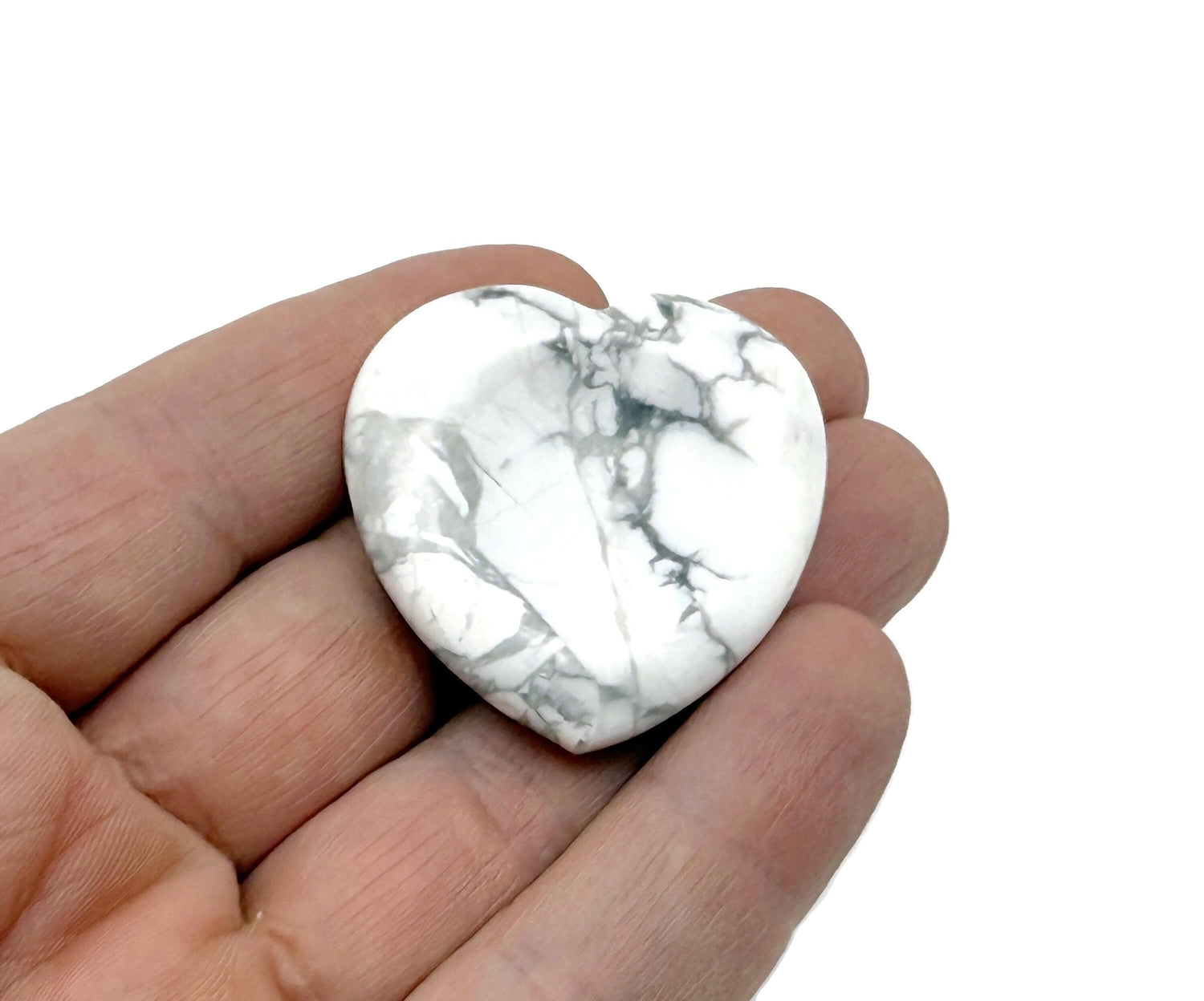 Soothing Howlite Heart Worry Stone from GemstoneGO, a calming crystal with smooth surface and natural white and gray pattern.