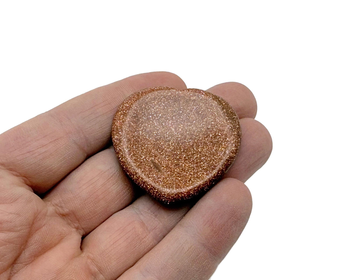 Goldstone heart-shaped worry stone from GemstoneGO, featuring a soothing crystal with a polished gold sparkle finish.