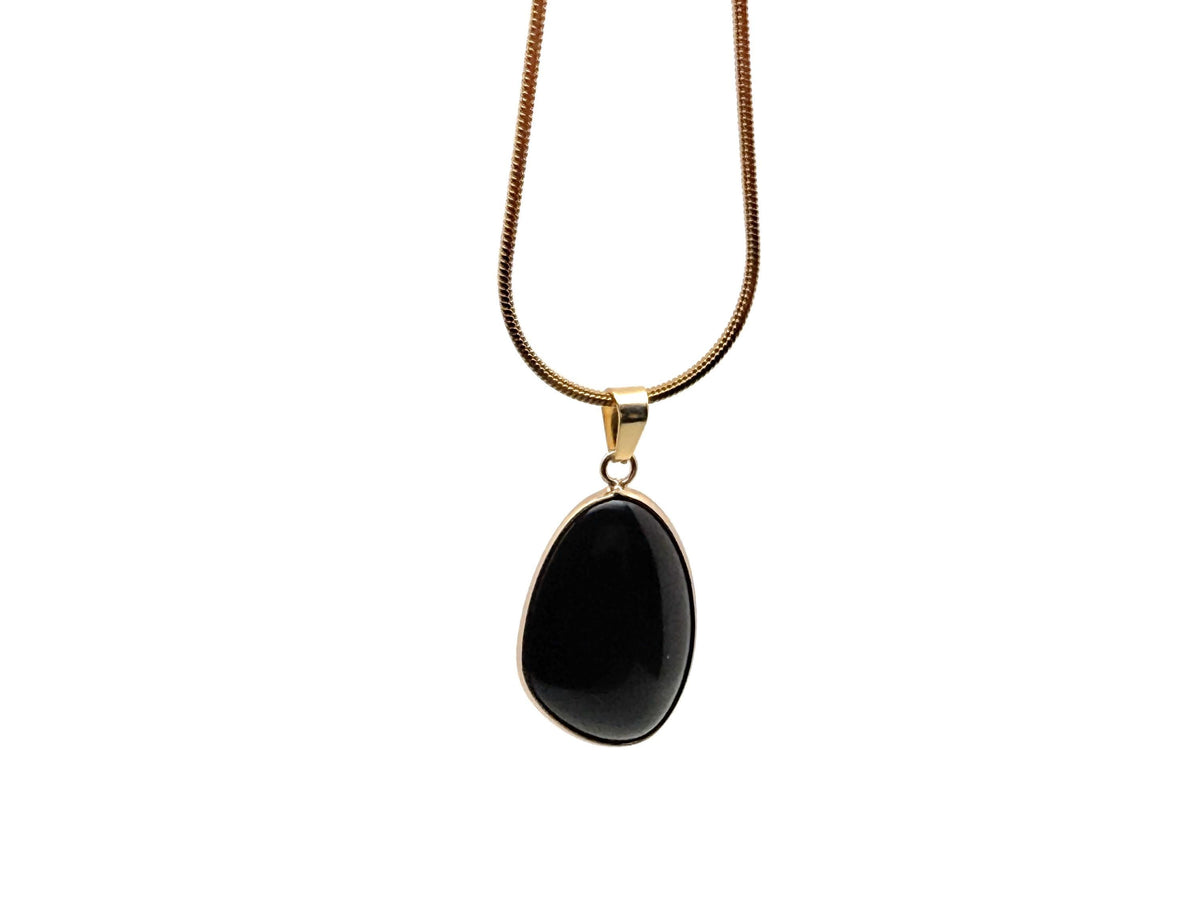 Dainty gemstone pendant with gold and silver crystals, featuring a birthstone charm, ideal for jewelry DIY and charm making.