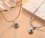Gold and silver mini evil eye pendant with Nazar design, featuring a protective evil eye charm from GemstoneGO.