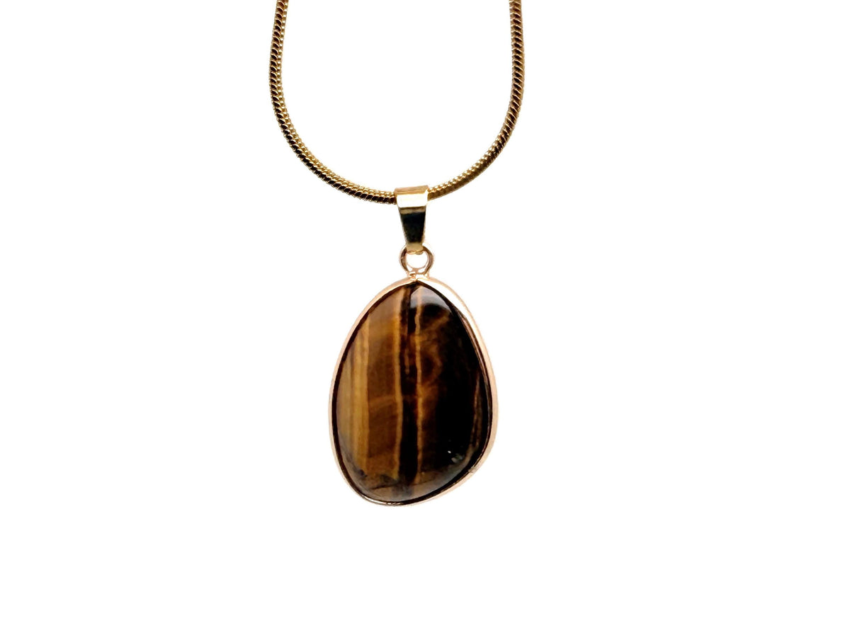 Dainty tiger eye gold gemstone pendant from GemstoneGO, showcasing a polished oval tiger eye stone on a delicate gold chain.
