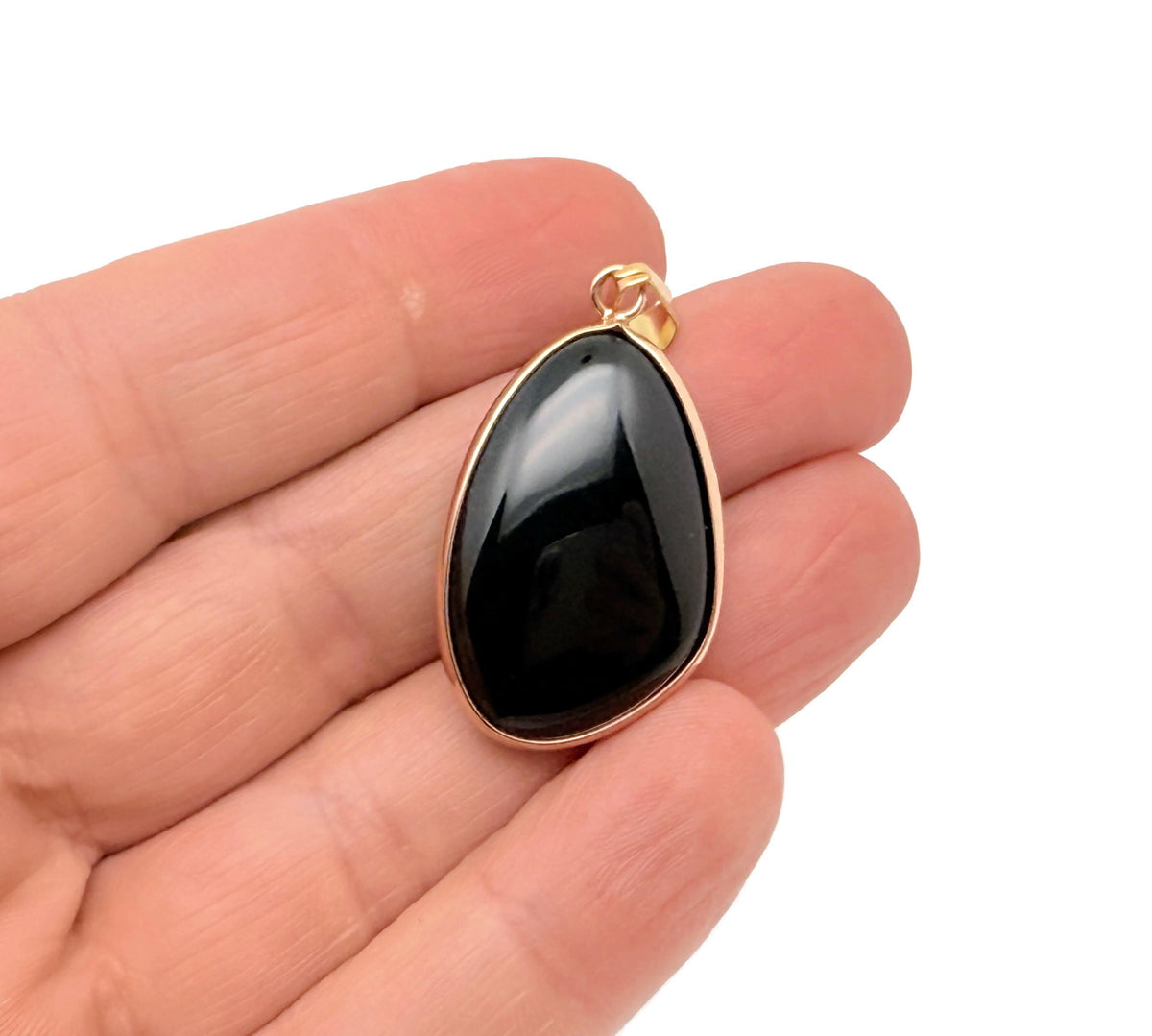 Dainty obsidian gold gemstone pendant with polished surface, featuring a gold-tone setting, ideal for DIY jewelry making.