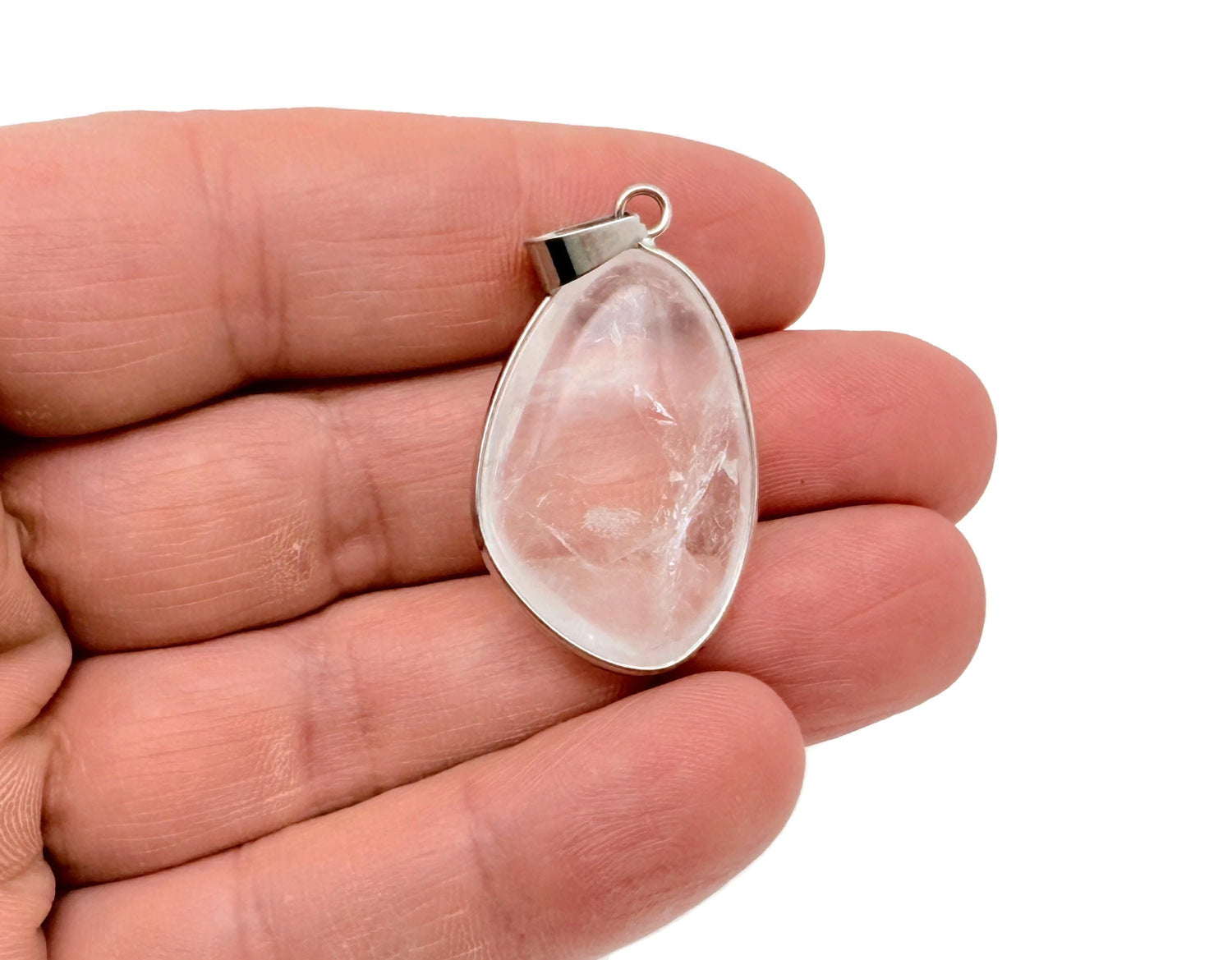 Dainty silver pendant featuring a clear quartz gemstone, perfect for DIY jewelry charms, by GemstoneGO.