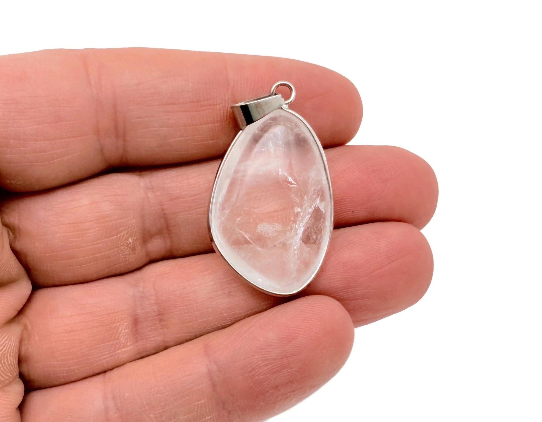 Dainty silver pendant featuring a clear quartz gemstone, perfect for DIY jewelry charms, by GemstoneGO.