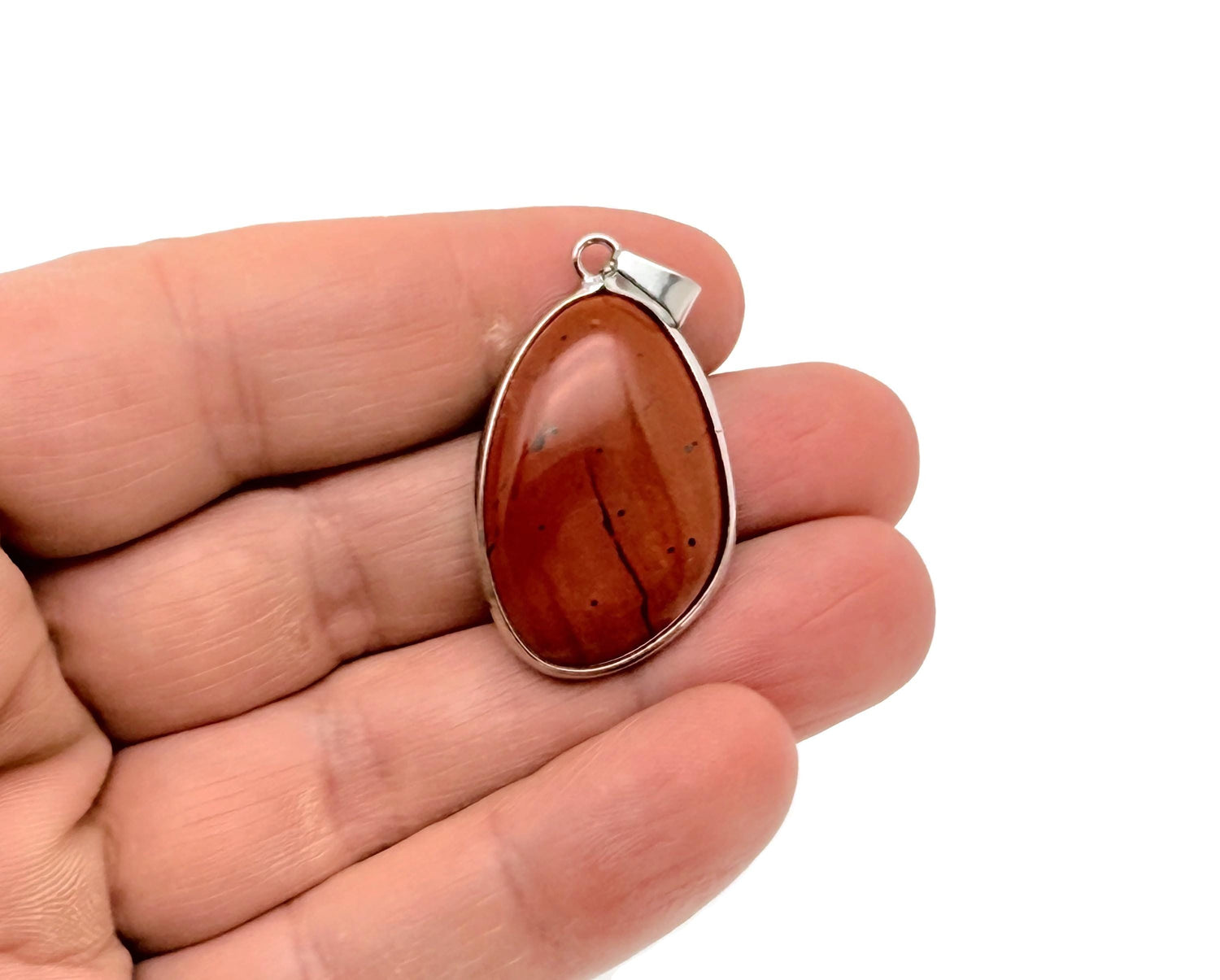 Red Jasper silver gemstone pendant with dainty jewelry charm, featuring a polished red Jasper stone and silver setting.