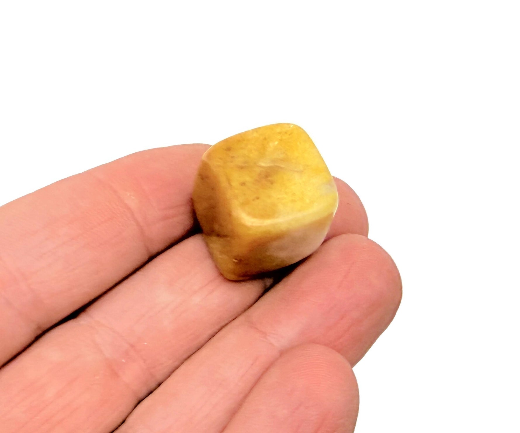 Handmade 16mm yellow jade cube gemstone from GemstoneGO, showing the smooth carved surface and vibrant yellow color.