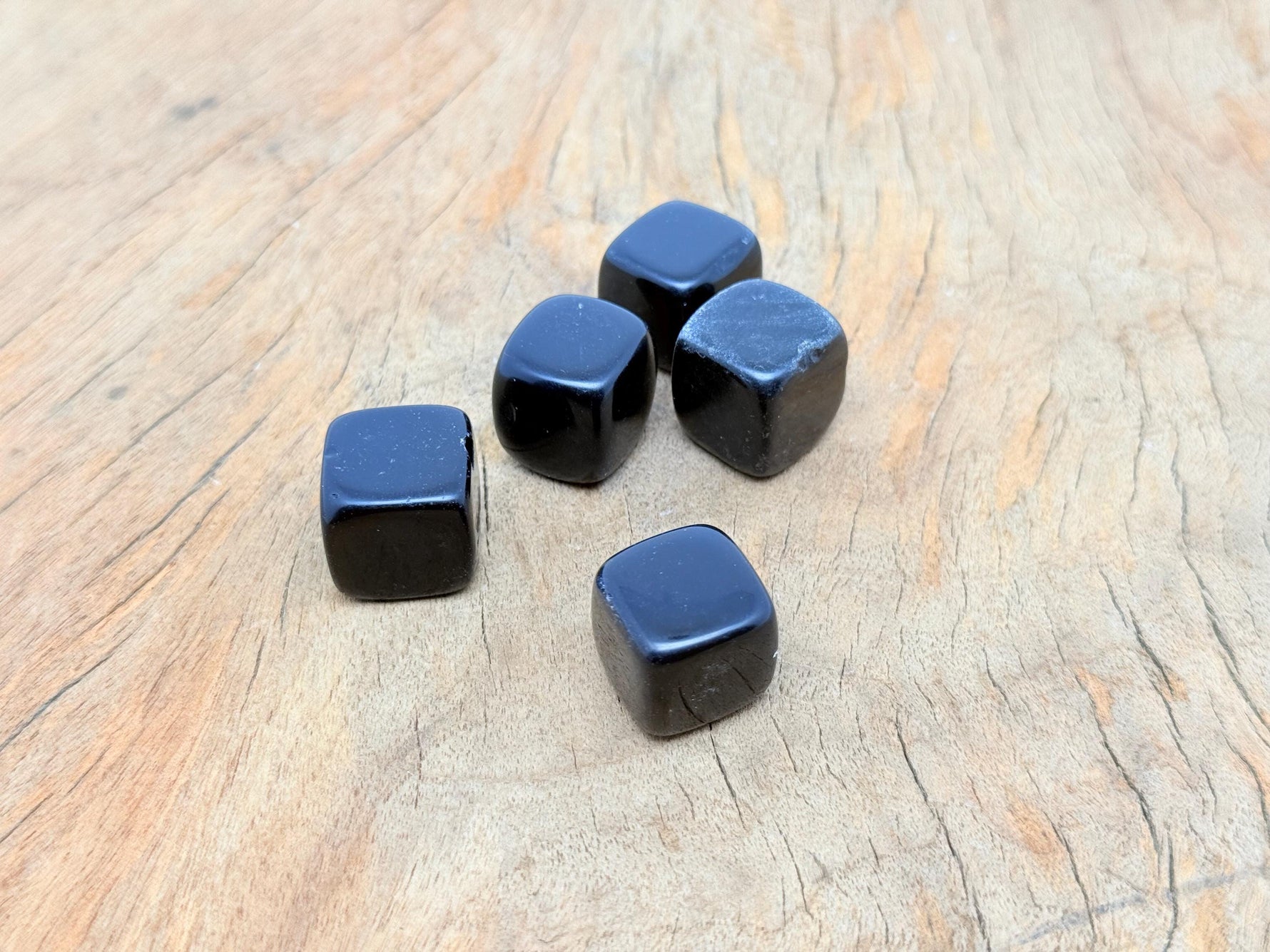 Handmade 16mm obsidian cube stone from GemstoneGO, carved and polished with natural black volcanic appearance.