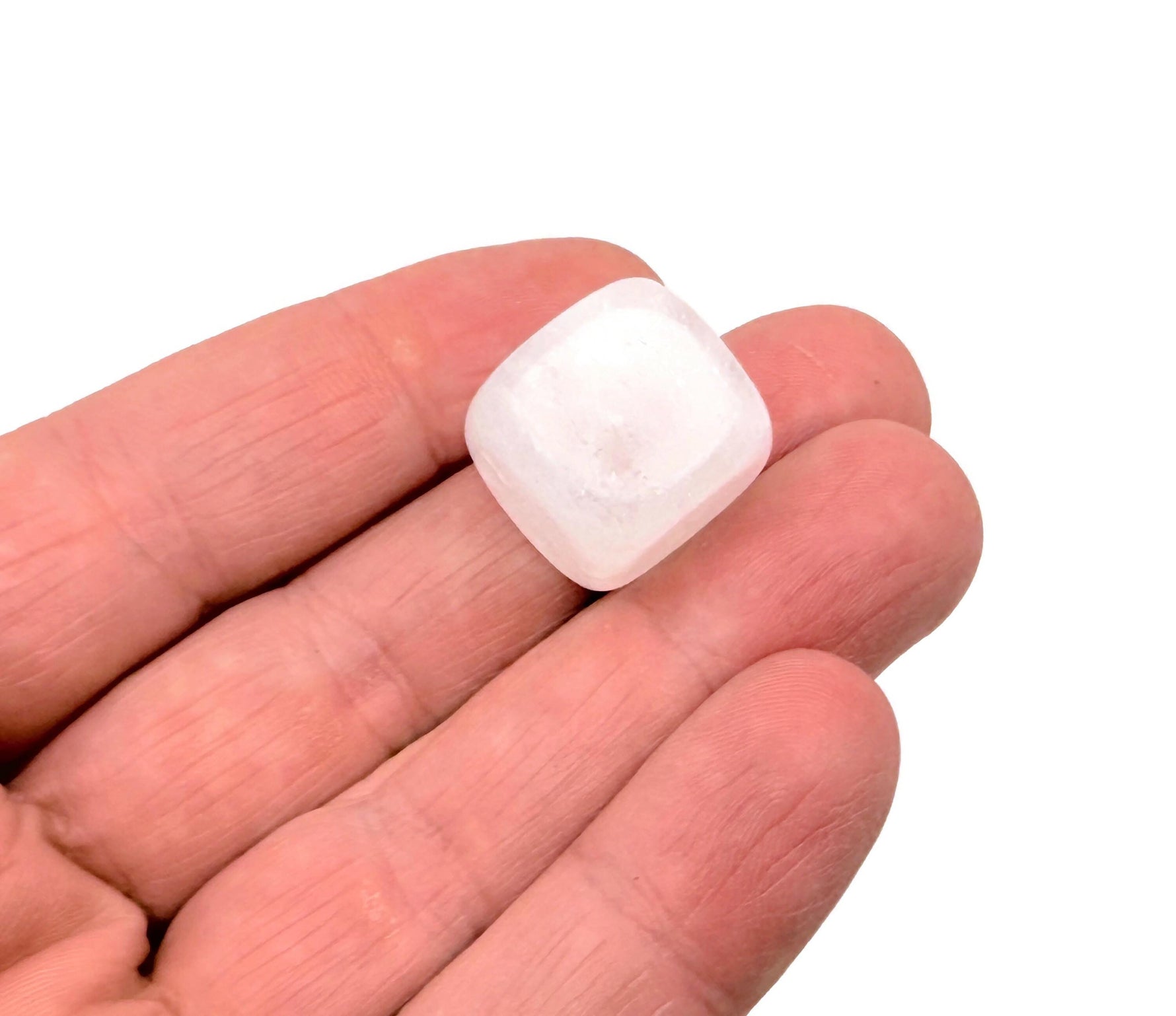 Handmade 16mm clear quartz cube stone from GemstoneGO, featuring a smooth carved surface on a neutral background.