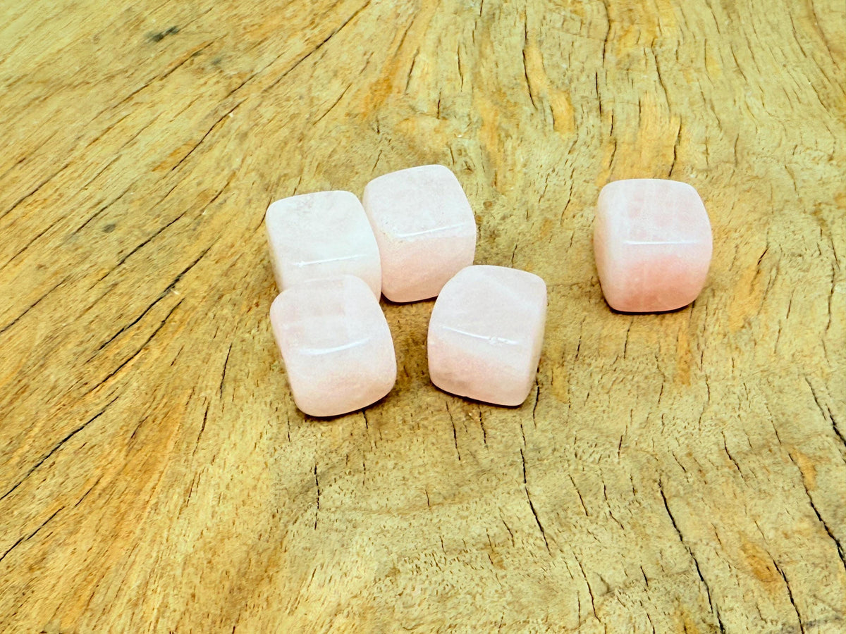 Handmade 16mm rose quartz cube stone with carved details from GemstoneGO, showcasing a smooth, polished pink gemstone.