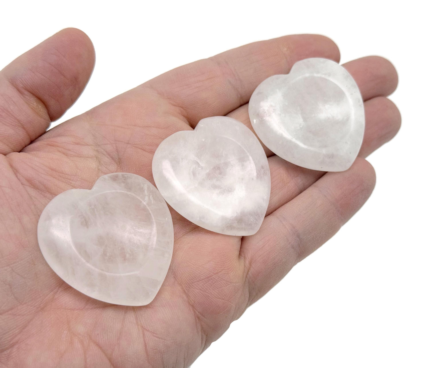 Clear quartz heart worry stone by GemstoneGO, soothing crystal with polished surface, ideal for stress relief and meditation.