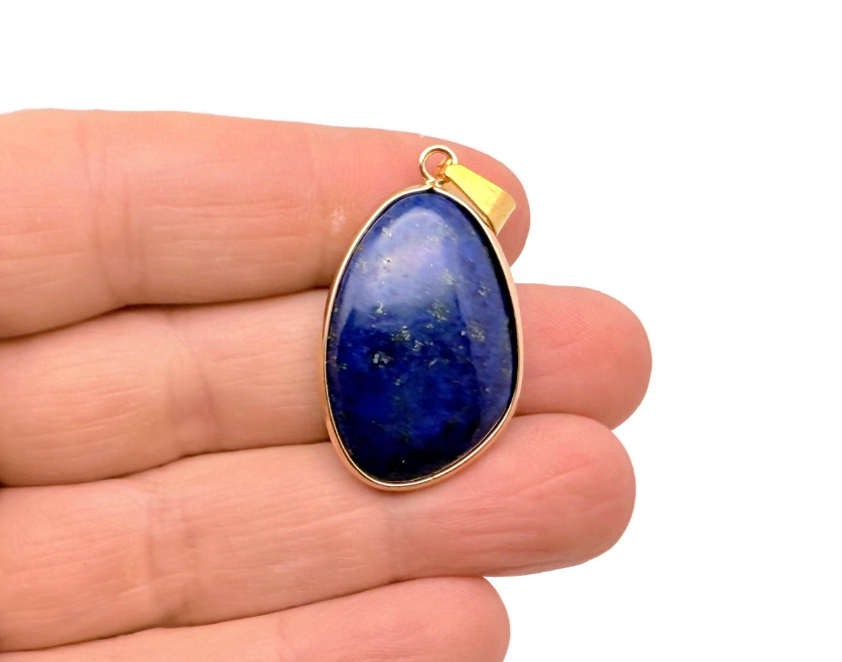 Dainty Lapis Lazuli gold gemstone pendant with a gold chain, featuring a vibrant blue stone and intricate gold detailing.