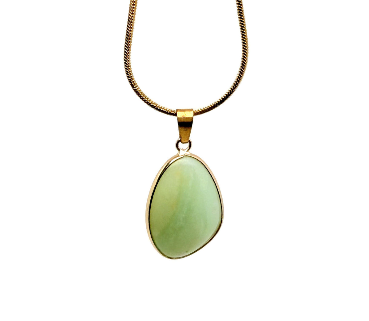 Dainty Amazonite gemstone pendant with gold setting, showcasing a natural blue-green stone on a jewelry display.
