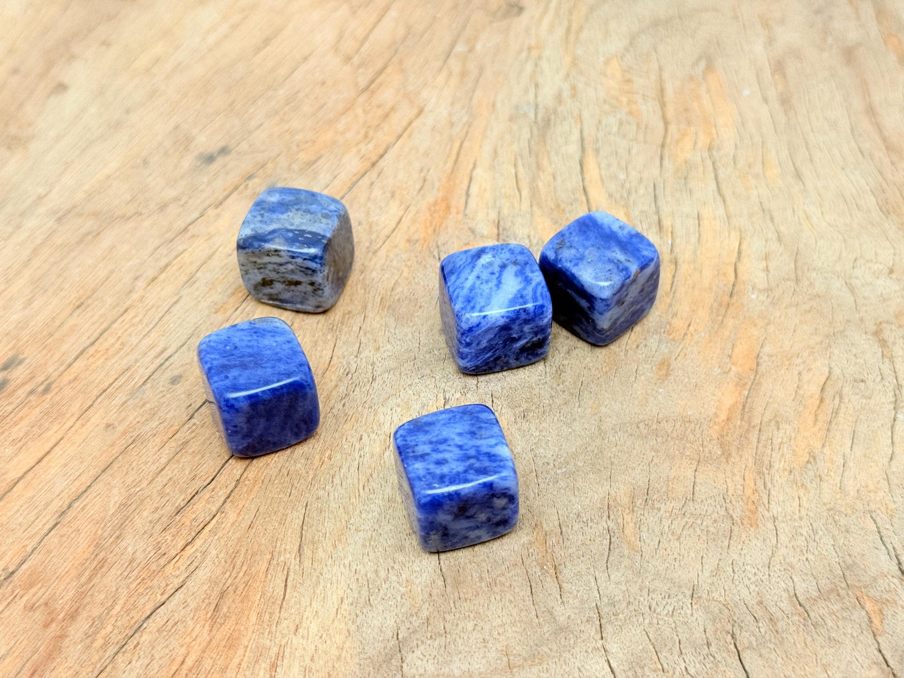 Handmade 16mm Sodalite cube stone with carved details, showcasing deep blue and white mineral patterns from GemstoneGO.
