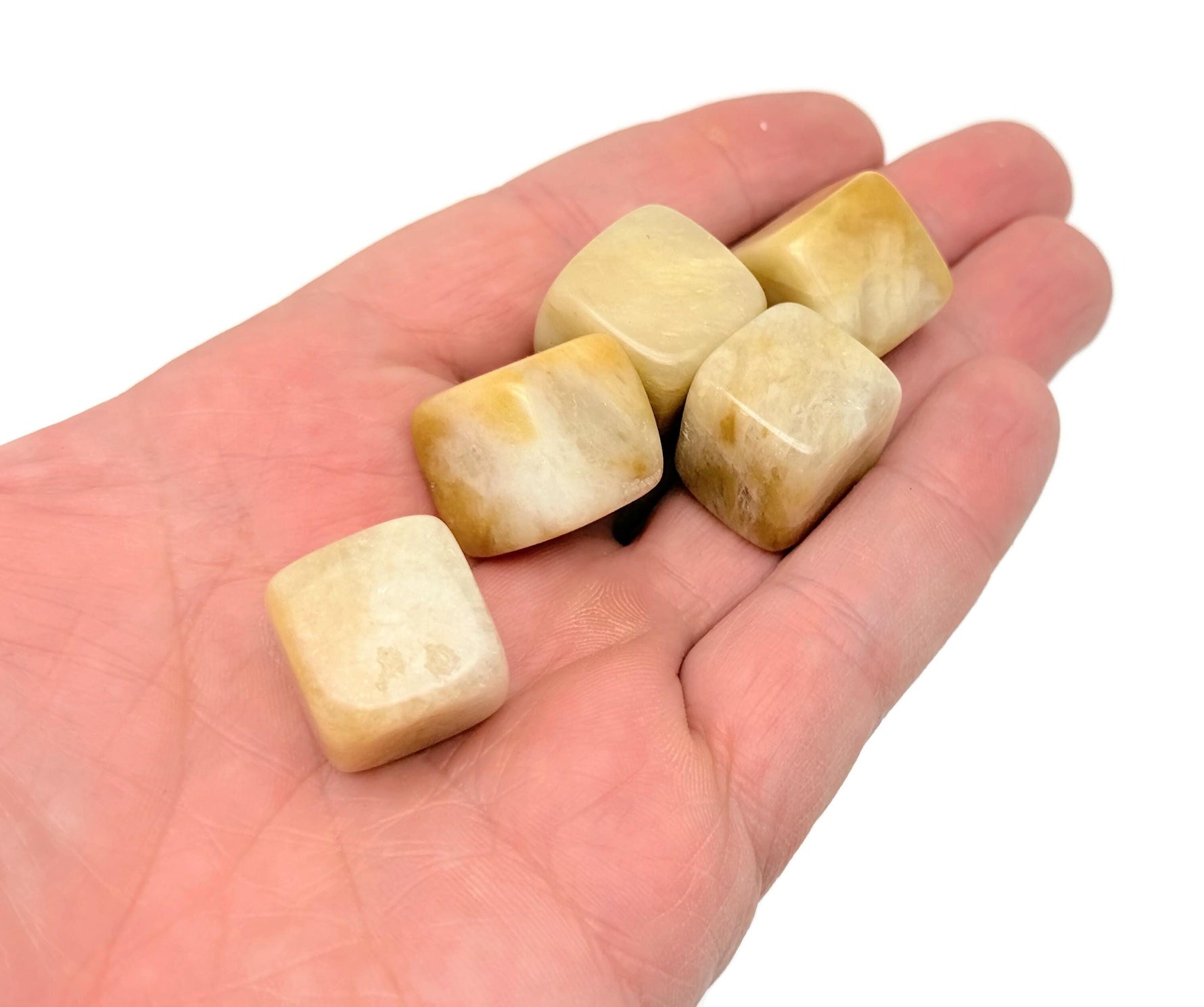 Yellow jade cube stone from GemstoneGO, handmade 16mm carved gemstone jewelry or craft stone on a neutral background.