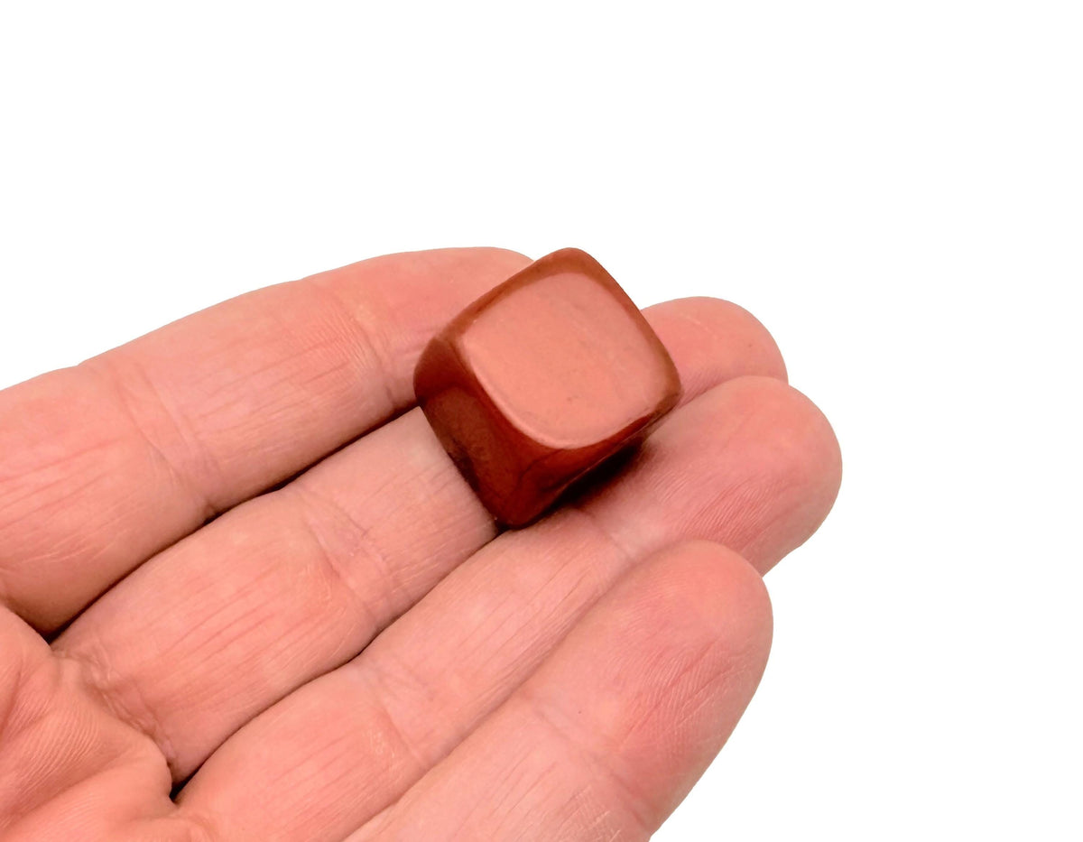 Handmade 16mm red Jasper cube stone from GemstoneGO, featuring a polished carved design on a neutral background.