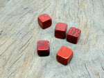 Handmade 16mm red jasper cube gemstone carved stone from GemstoneGO, showcasing its rich red color and smooth, polished surface.