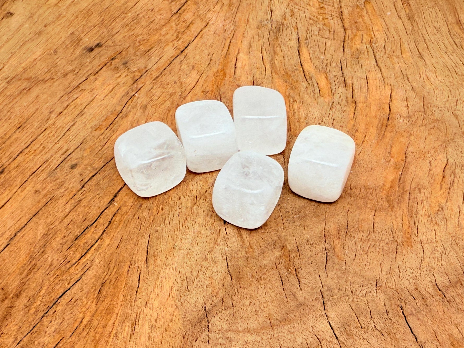 Handmade 16mm clear quartz cube stone from GemstoneGO, showcasing its smooth, carved, transparent crystal surface.