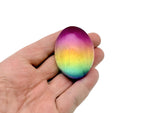Rainbow Aura Quartz palm gemstone spa stone, 50mm, with vibrant iridescent colors and smooth polished surface from GemstoneGO.